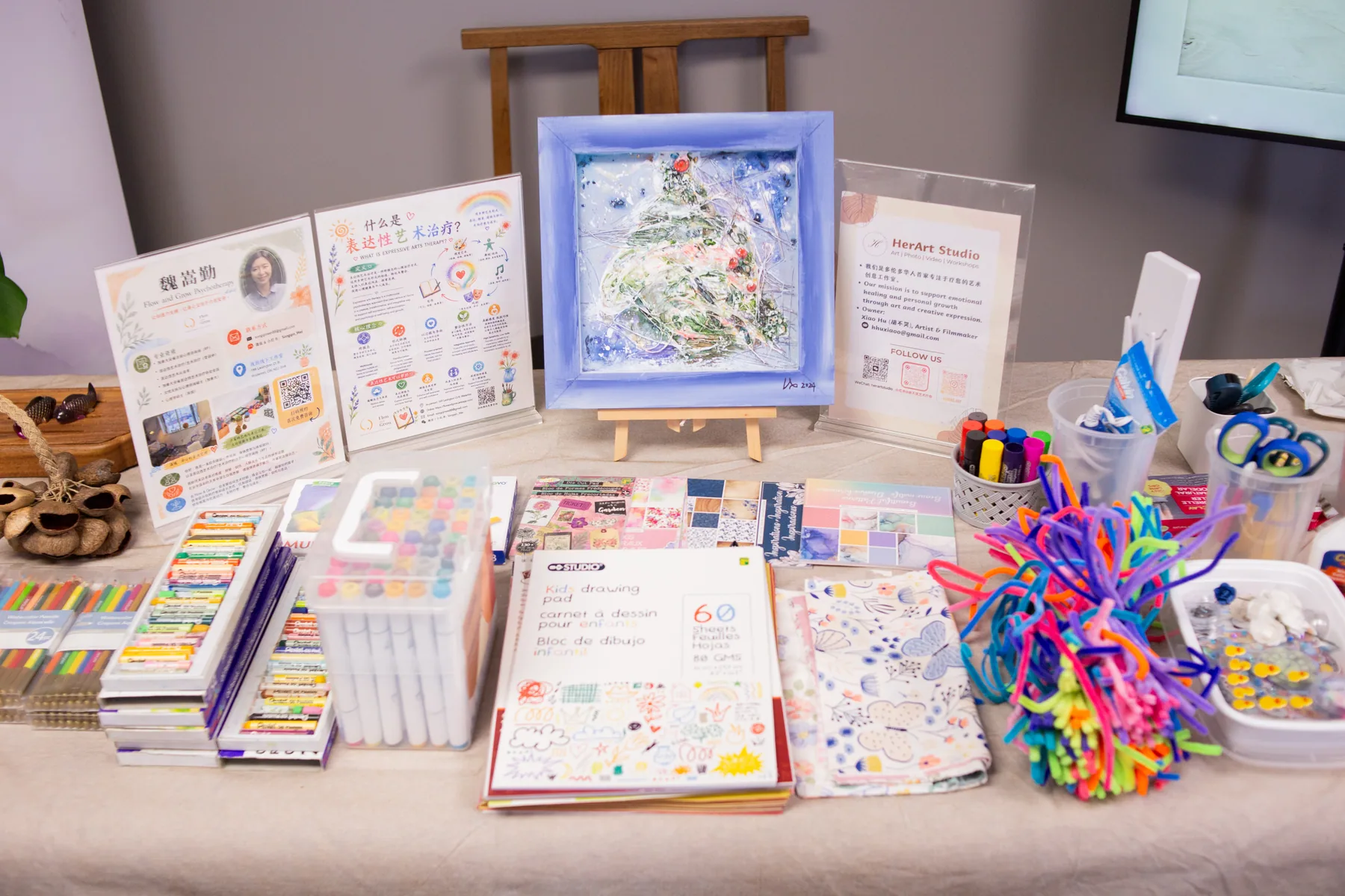 A welcoming table arranged with colorful creative materials