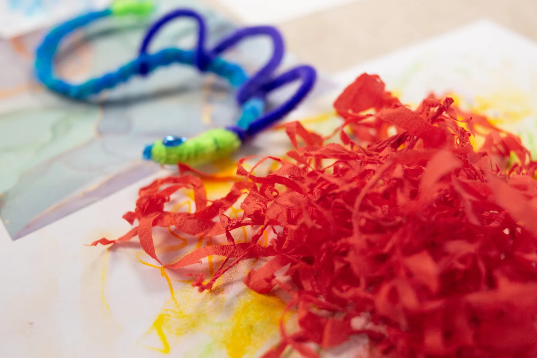 Colorful fiber and art materials gathered during a shared making process