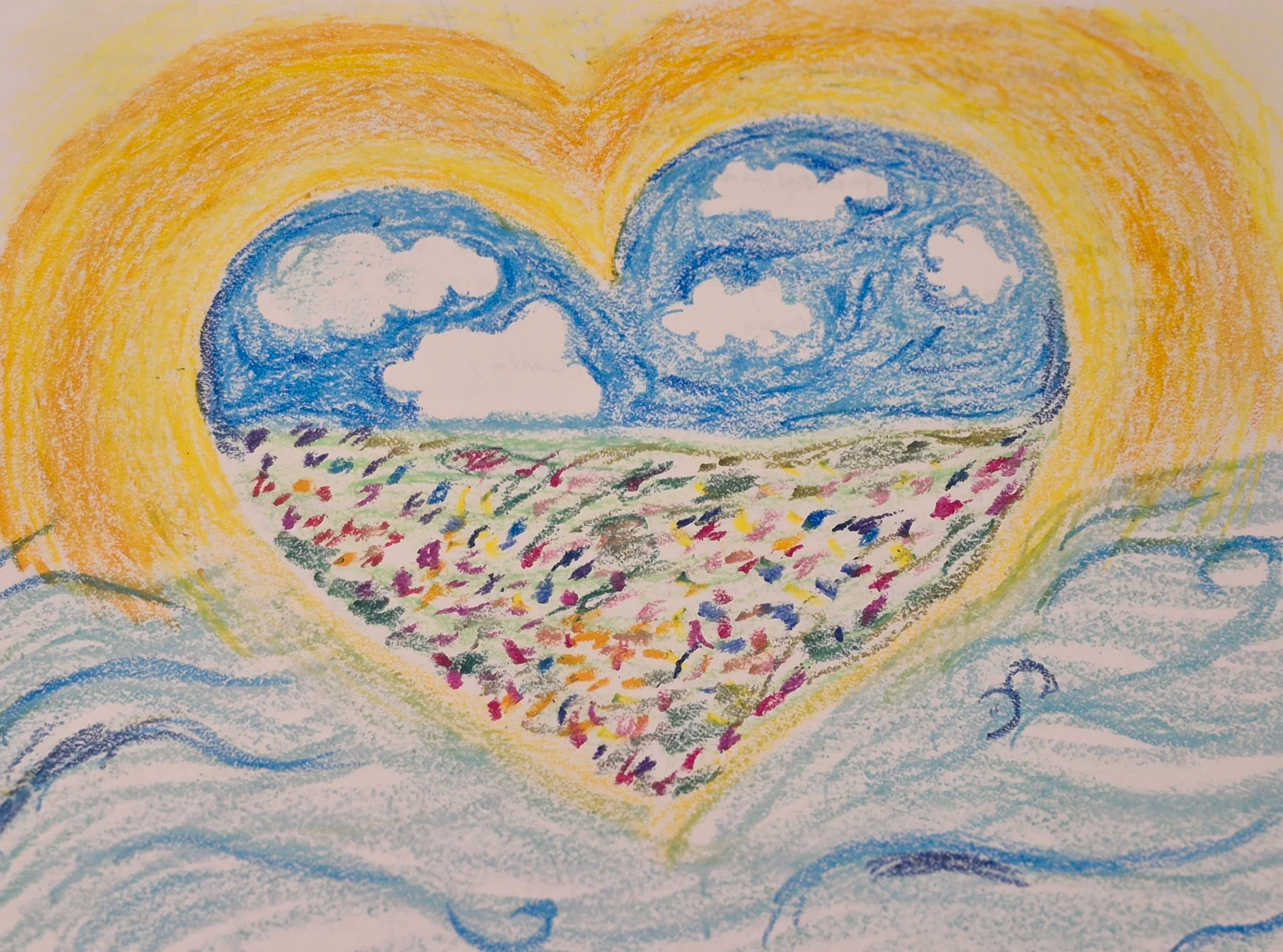 A colorful heart-shaped drawing filled with sky, clouds, and a field